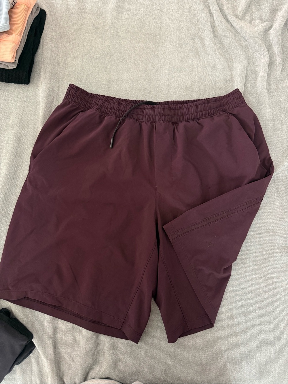 Lululemon Pace Breaker Short 9 inch in color 
Black Cherry mens lululemon shorts